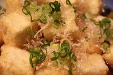 Agadashi Tofu Lightly cooked tofu served in tempura sauce with bonito at Hana Japanese Eatery.