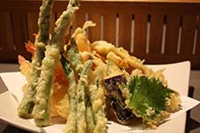 Hana Tempura Shrimp and vegetables cooked in a delicate batter served with tempura sauce at Hana Japanese Eatery